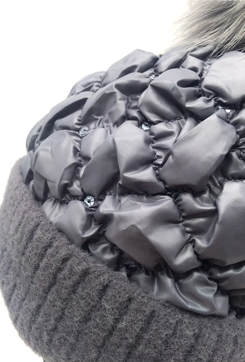 PADDING FABRIC LIKE BEANIE. COMES IN A SET OF 3 FUR POMPONS