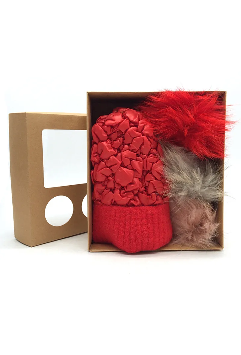 PADDING FABRIC LIKE BEANIE. COMES IN A SET OF 3 FUR POMPONS